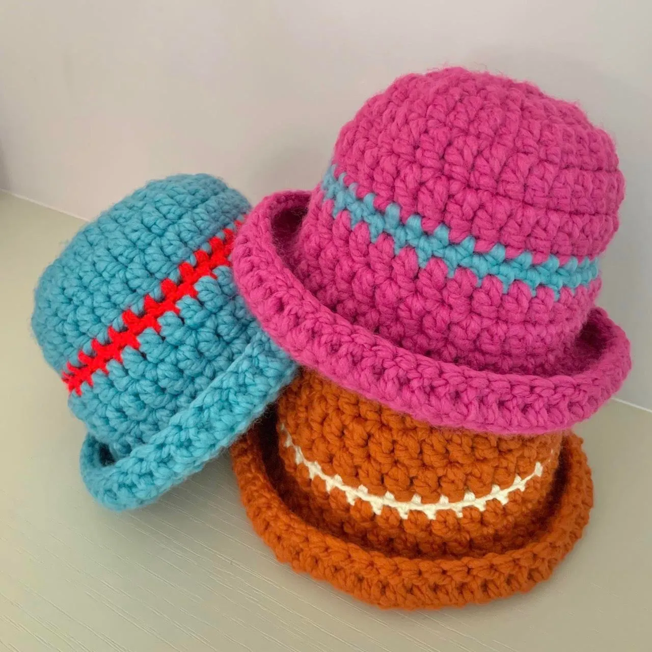 Handmade sea blue chunky crochet bowler hat with red stripe