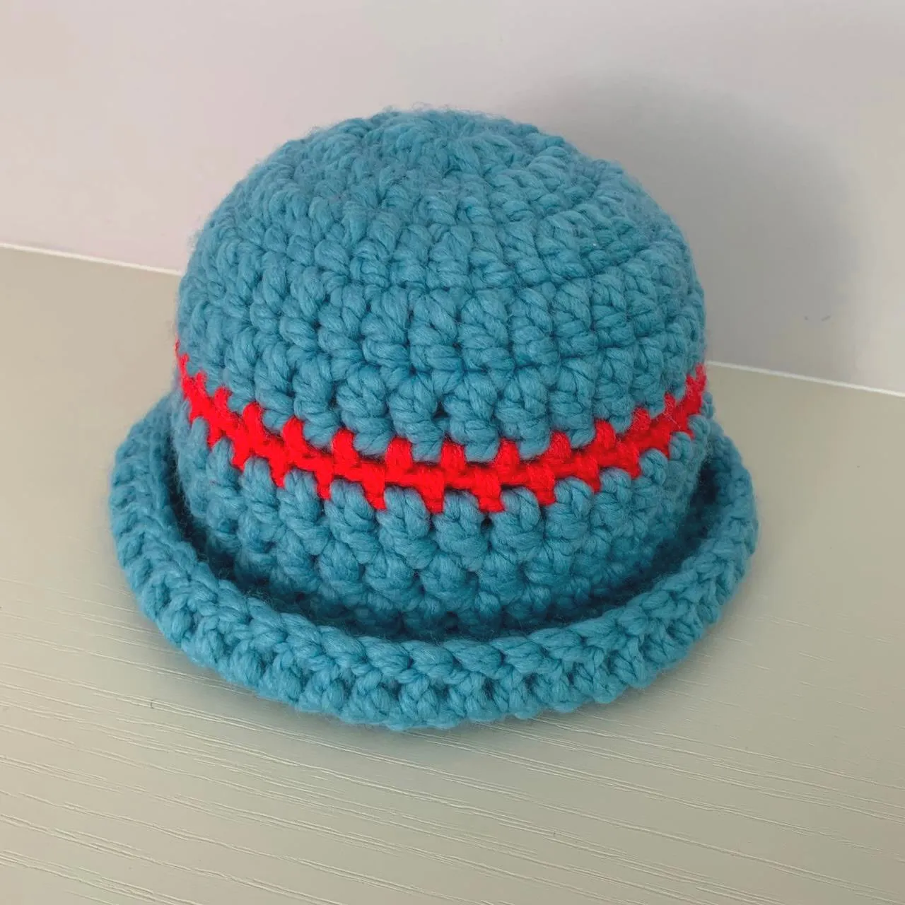 Handmade sea blue chunky crochet bowler hat with red stripe